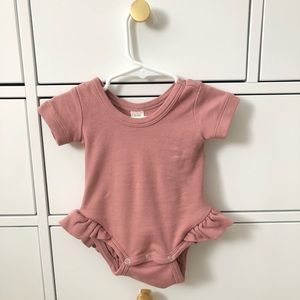 Kate Quinn ruffle leg bodysuit